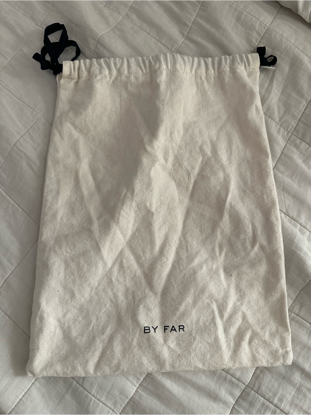 BY FAR Cream Canvas Drawstring Bag with Black Ties